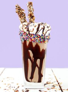This Girl Scout cookie favorite inspired Samoa Milkshake is creamy, dreamy and packed full of yummy chocolate, caramel, and toasted coconut. 