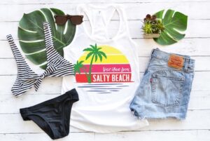 With a cool vintage vibe, this Visit Your Local Salty Beach tee shirt is sure to be a hot new staple to your summer wardrobe. Get the free SVG file to make your own!