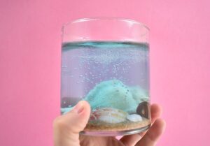 Add a lovely beach-inspired touch to your home decor turning your ocean vacation finds into gorgeous DIY seashell candles.