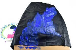 Starting with your first color choice create an interesting and unique shape. Take inspiration from a Google image search of galaxies if you need some help, or mimic our design shown here.