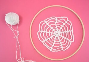 Crochet spider webs should be smaller than your wood embroidery hoop. If using multiple hoops make your webs varying sizes for an interesting visual look.