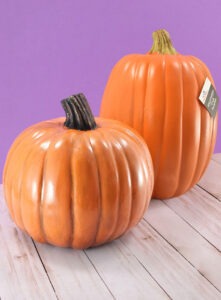 Make fake pumpkins look real! The one in the front has been DIYed to be a realistic fake pumpkin while the original in the back just looks plain fake!