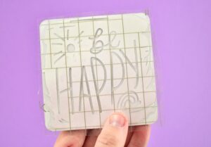 When applying heat to Cricut Infusible Ink the coasters are placed upside down. The heat goes through the backside of the coaster to transfer the color from beneath.