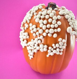 Continue adding warts to your pumpkin until you are happy with the coverage. Or until you run out of clay. Or whenever you decide you're over making warts.