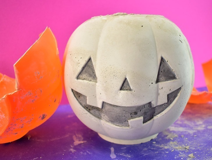 Thin down black paint with a considerable amount of water. Apply to the inset eyes, nose and mouth to help them pop.