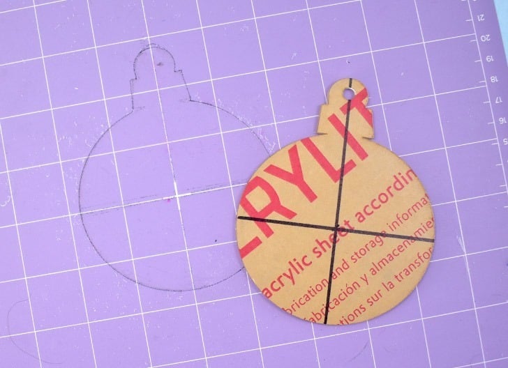 If you're happy with the placement of the engraving on your ornament BEFORE YOU REMOVE IT FROM THE MAT, use a fine point market to trace around the entire shape.