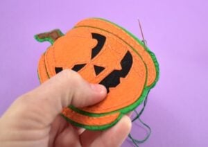 Continue stitching around the sides to close up completely.
