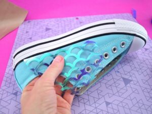 Cut interesting shapes out of different fish scales and place them as you'd like on the sneaker's canvas.