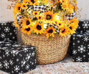 Artificial Christmas tree bases are plain ugly. If a tree skirt doesn't work well for you it's possible to secure a small Christmas tree inside of a woven basket.