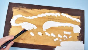 First, paint your darker color your board and allow the paint to dry.  For this board, I only painted the edges but for my next, I covered the entire board with the undercoat. I strongly suggest painting the entire board. Next, paint over your first coat of paint with your primary paint color and allow it to dry. Add a second coat if needed and give it time to dry as well.