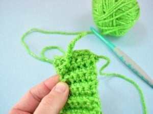 Continue matching up stitches on both sides of the band and slip stitch the sides together.