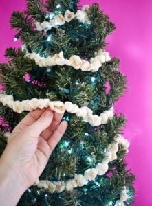 A surprising supply from the hardware store makes the most perfect fake popcorn garland. DIY a little bit of tradition that will last for years!