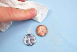 Cleaning pennies with Brasso is really easy and is the only method that doesn't require a toothbrush to scrub.
