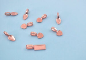 Turning a penny into a pendant is easy with glue on bails.