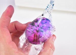 Remove eggs from the refrigerator. Open and run each egg individually under water until it runs clear.