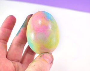 Apply a dot of paint onto a clean paper towel and rub paint into the areas where the colors overlap.