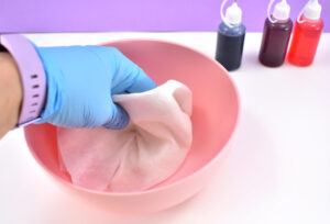 Take a small piece of tee shirt material or a paper towel and dip it into the straight vinegar.