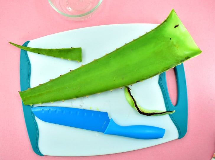 Slice off the top 2 inches from the aloe leaf.