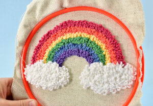 For my punch needle rainbow I used a #14 fine Oxford Punch Needle for the rainbow and a #10 fine for the shaggier white cloud loops.