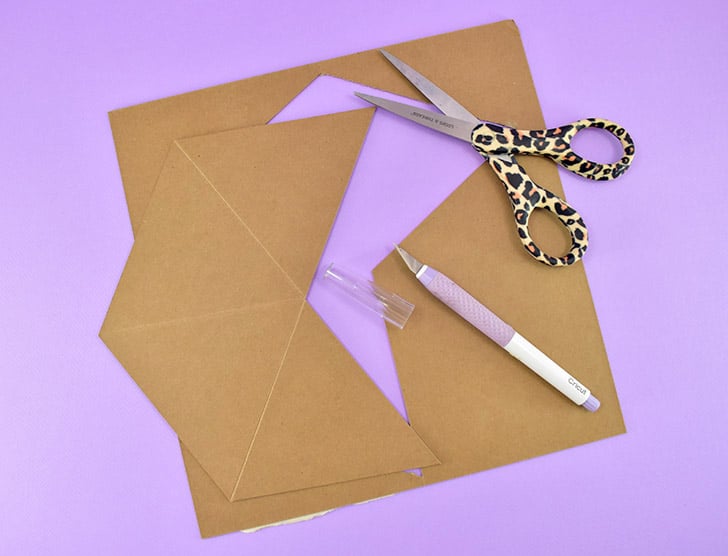 Sometimes the cut might not go all of the way through the chipboard in some areas. Use a sharp craft knife to finish the cut. Pop the piece out of the chipboard.