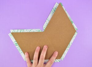 Flatten your top chipboard piece back out and lay on the backside of your printed paper.