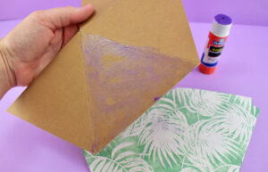 Working one section at a time, apply adhesive and allow it a moment to become tacky.