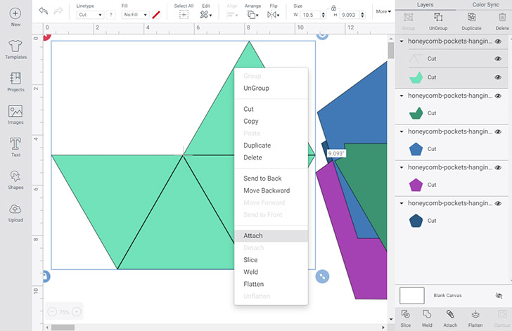 The front piece of each pocket has lines that need to be either scored or drawn onto the chipboard. Select the light green shape with the lines on top of it and isolate it from the other shapes. Right click and select "Attach".