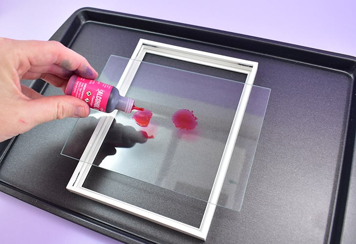 Remove the glass from your frame and clean well using glass cleaner. Allow to dry completely and place on top of a non-flammable work surface, like a cookie sheet.