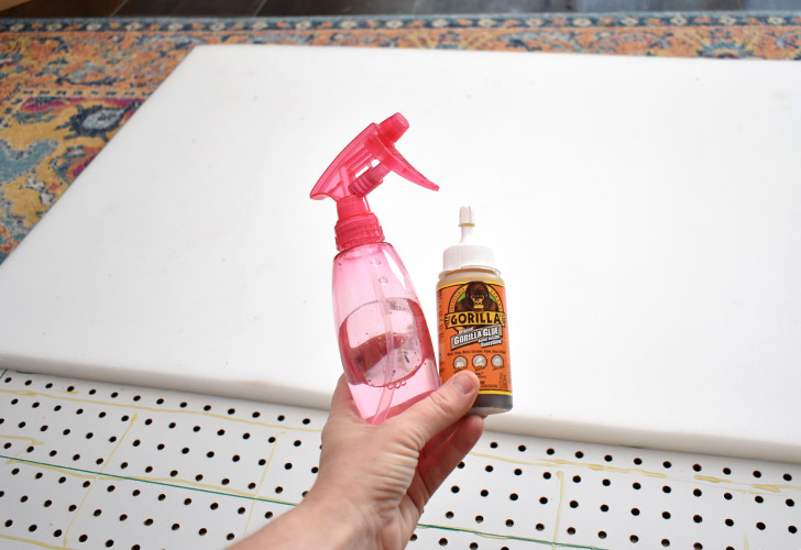 Using either Gorilla Glue and Water or Spray Adhesive, secure your foam to the front of your pegboard.