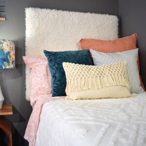 This DIY furry headboard is super easy to make and so comfy to rest against. Add some fun bohemian flair to your bed with a faux fur headboard!
