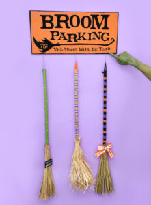 How fun is this DIY broom parking sign complete with parked brooms? Get the free cut files to make your own witch parking + tutorial!