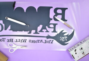 Cut and weed your Broom Parking design from heat transfer vinyl.