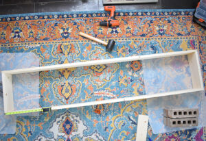 Put together the rectangular shape of your shelf together on your work surface.