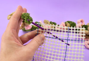 Grab onto the loop with the hook.