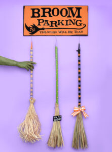 How fun is this DIY broom parking sign complete with parked brooms? Get the free cut files to make your own witch parking + tutorial!