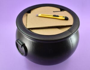 To keep the cauldron lightweight and to use less foam, cut up and fill the inside with cut cardboard.