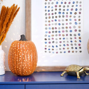 This drilled pumpkin light is super easy to make and looks great on display all fall long! See how to make your own with this full tutorial!