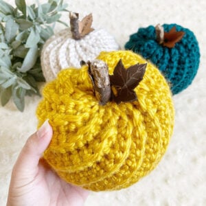 We love these 20+ knit, crochet, loom knit, and otherwise DIY yarn pumpkins you are going to want to craft up this fall!