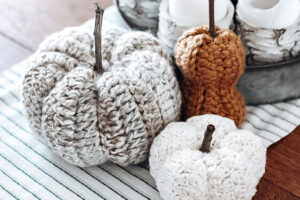 We love these 20+ knit, crochet, loom knit, and otherwise DIY yarn pumpkins you are going to want to craft up this fall!