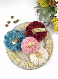 We love these 20+ knit, crochet, loom knit, and otherwise DIY yarn pumpkins you are going to want to craft up this fall!