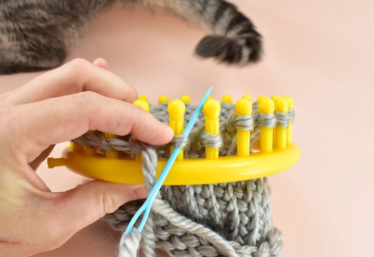 Quick Tip - If the loop tries to slip off of the loom, hold it in place with one hand while pulling your needle through with the other.
