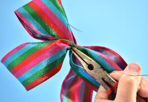 Grab the wire with your needle-nose pliers and give the wire a few extra turns. You'll notice that you get an extremely tight hold. Don't overtighten, however, as you can break the fairly thin wire.