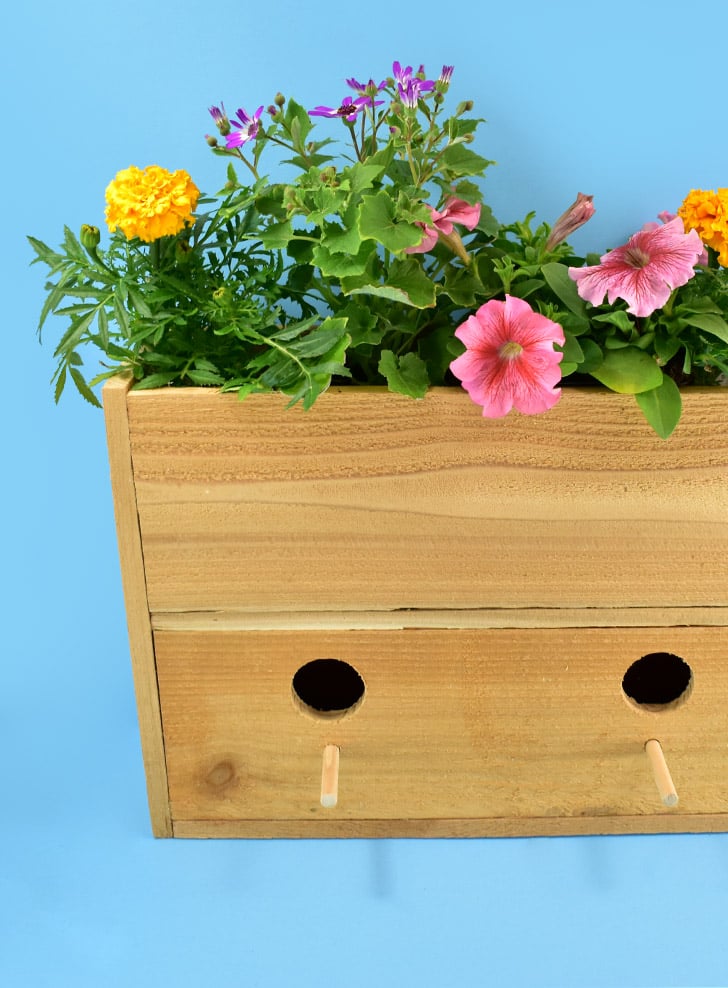 Build a Cedar Picket Birdhouse Planter. Perfect for both gardeners and bird lovers plus it is super easy and inexpensive to make!