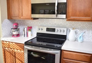 Want to update your kitchen on a budget? See how we made our own DIY peel and stick backsplash tile for a whole new look!