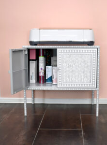 Not only does a maker fit perfectly on top of this cabinet, the interior is the perfect size for all materials Cricut!