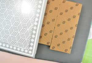 Place the cardboard inserts from the cabinet packaging inside of the metal piece.