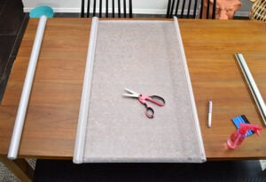 Measure the first section of your window. Unroll the privacy film to the right size and trim with a pair of scissors.