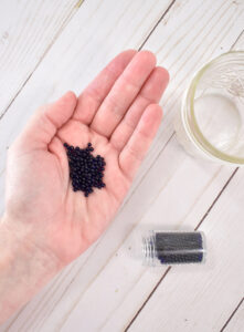 Measure out 1 teaspoon of water beads for every 8 ounces your mason jar holds. * Note - typical mason jars hold 16 ounces. Smaller "jelly jar" style mason jars typically hold 8 ounces. I am using 8 ounce jars for this tutorial.