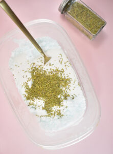 Add 1/2 a cup of washing powder and and 3 tablespoons of crushed rosemary. Fluff and stir with a fork until well combined.