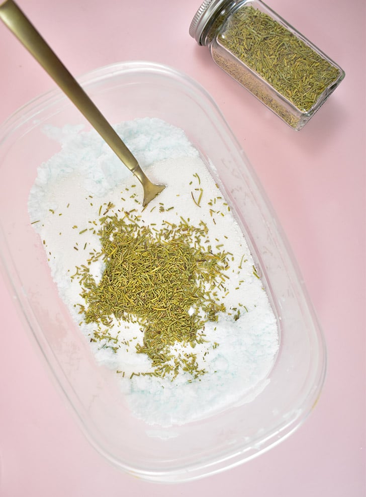 Add 1/2 a cup of washing powder and and 3 tablespoons of crushed rosemary. Fluff and stir with a fork until well combined.